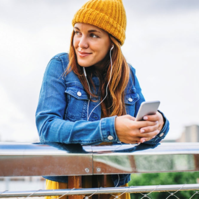 Young woman outside with phone